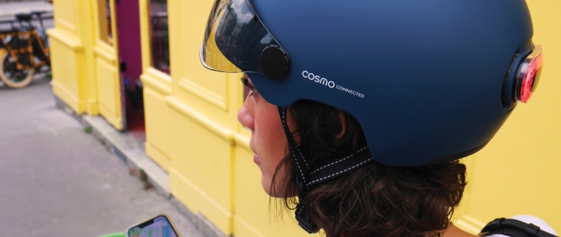 Cosmo Connected smart helmet with rear light near Eiffel Tower — showcasing innovative urban mobility gear enabled by GS1 GTINs and digital product data